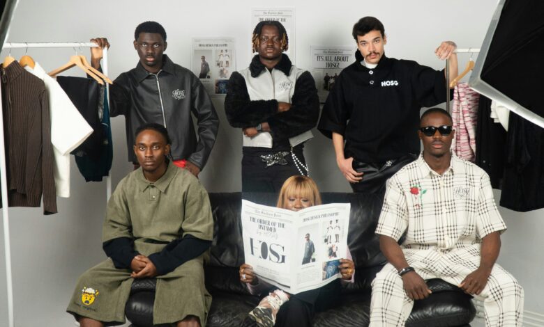 Group in a studio brand shoot, illustrating the question is J.Crew fast fashion and how clothing labels are built