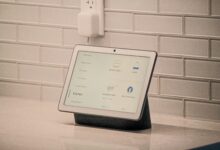 How to connect Google Home to wifi shown on a Nest Hub display controlling lights and a thermostat in a kitchen