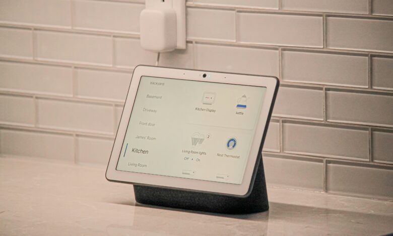 How to connect Google Home to wifi shown on a Nest Hub display controlling lights and a thermostat in a kitchen
