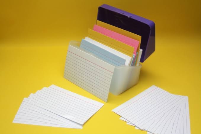 how to set and achieve your goals person writing goals in notebook